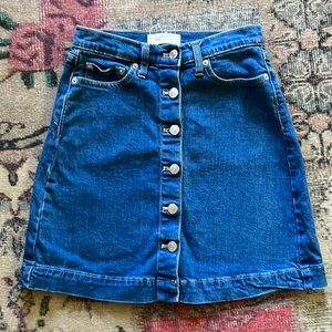 High-waisted, button-up, denim skirt. Vintage-style.